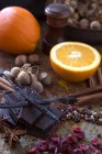 Chocolate, orange, hazelnuts and spices — Stock Photo