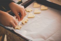 Boy baking cookies, closeup view — Stock Photo