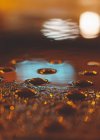 Close-up of neon signs and lights reflected in a puddle, Chicago, Illinois, United States — Stock Photo