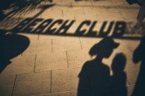 Shadow of mother and son at a Beach club — Stock Photo