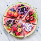 Watermelon pizza with fruit, chocolate and yogurt toppings — Stock Photo