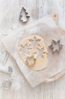 Cookie dough and Christmas cookie cutters — Stock Photo
