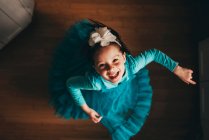 Overhead view of a happy girl spinning around — Stock Photo