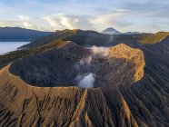 Sunrise at Bromo Tengger Semeru National Park in East Java, Indonesia taken with the dji Mavic Pro Platinum. Low clouds visible around Mount Bromo crater. — Stock Photo