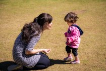 Mother and daughter playing in the park, Brazil — Stock Photo