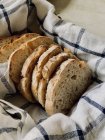 Fresh bread in a basket, closeup view — Stock Photo
