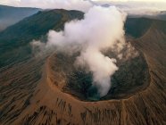 Sunset at Bromo Tengger Semeru National Park in East Java, Indonesia taken with a drone. Low clouds visible around Mount Bromo crater. — Stock Photo