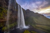 Scenic view of Seljalandsfoss at sunset, South Iceland — Stock Photo