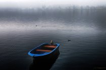 Rowing boat in the fog, Lake Maggiore, Piedmont, Italy — Stock Photo