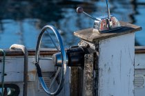 Steering wheel on an old fishing boat — Stock Photo