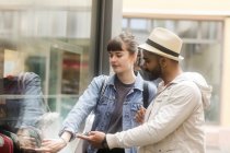 Couple window shopping in the city — Stock Photo