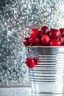 Bucket filled with fresh cherries, closeup view — Stock Photo