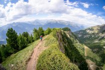 Woman Mountain Biking near Mont Blanc, Aosta Valley, Italy — стоковое фото