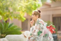 Portrait of a woman wearing a traditional Japanese kimono — Stock Photo