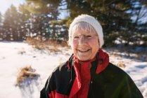 Portrait of a senior woman standing outdoors in winter, United States — Stock Photo