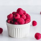 Closeup view of Ramekin dish filled with raspberries — Stock Photo
