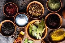 Spices and herbs on wooden background — Stock Photo
