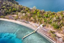 Aerial view of boat moored along a wooden jetty, Satonda island, West Nusa Tenggara, Indonesia — Stock Photo