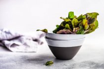 Beetroot leaves in ceramic bowls — Stock Photo