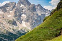 Man and woman mountain biking in the Dolomites, Italy — Stock Photo