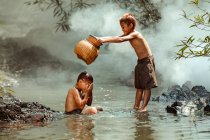 Two boys washing in a river, Thailand — Stock Photo