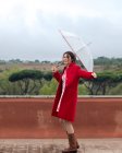 Woman dancing in the rain with an umbrella, Rome, Lazio, Italy — Stock Photo