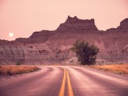 Badlands National Park Road at Sunset during Wildfire, South Dakota, USA — стокове фото