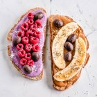 Peanut butter and berry yoghurt toasts with chocolate Easter eggs — Stock Photo