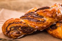 Two Cinnamon pecan swirl pastries on a napkin — Stock Photo