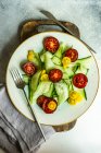 Overhead view of a cucumber and tomato salad — Stock Photo