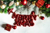 Merry Xmas and Christmas decorations on white background — Stock Photo
