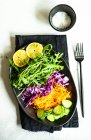 Red cabbage, rocket, carrot and cucumber with salt and lemon — Stock Photo