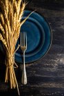 Bunch of wheat on a Thanksgiving place setting — Stock Photo