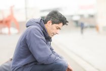 Man sitting on a bench thinking, Germany — Stock Photo