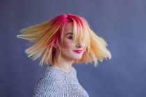 Portrait of a woman with dyed hair spinning around — Stock Photo