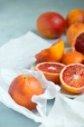 Close-up of sliced blood oranges on a table — Stock Photo
