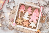 Box of home made Christmas cookies and Christmas decorations — Stock Photo