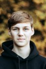 Portrait of teenage boy standing outdoors — Stock Photo