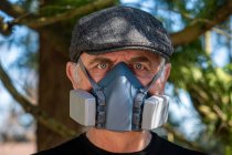 Portrait of man wearing filter mask — Stock Photo