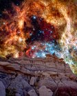 Fotografia conceitual da Nebulosa de 30 Doradus subindo sobre um cume na Floresta Jasper, Parque Nacional da Floresta Petrificada, Arizona, EUA — Fotografia de Stock