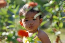Portrait of a girl in a garden, Indonesia — Stock Photo