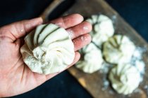 Person preparing traditional Georgian dumplings — Stock Photo