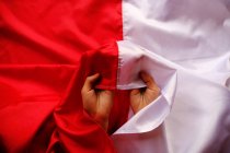 Hands holding an Indonesian flag, Indonesia — Stock Photo