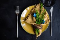 Christmas table setting for holiday dinner on black concrete background with copy space — Stock Photo