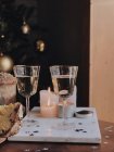 White wine and panettone next to candles — Stock Photo