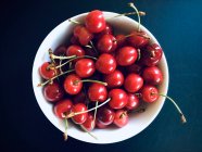 Bowl of fresh cherries, top view — Stock Photo