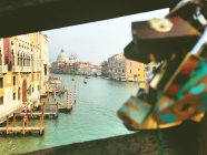 Canal view through metal railings on a bridge, Venice, Veneto, Italy — Stock Photo