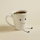 Tazza di caffè con un sorriso sopra — Foto stock