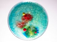 Soap bubbles and acrylic paint in oil — Stock Photo