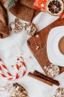 Cup of coffee next to Christmas baubles, jewelry and Christmas decorations — Stock Photo